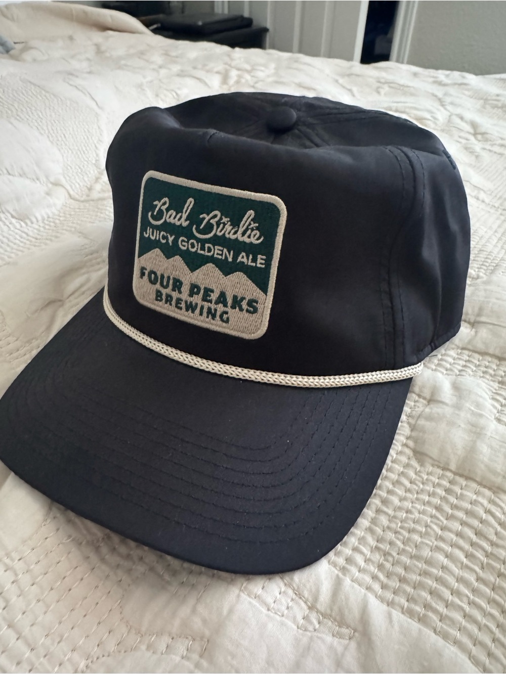 Bad Birdie Black Trucker Cap with Cream Script